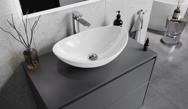Modern gray bathroom with a white glass sink