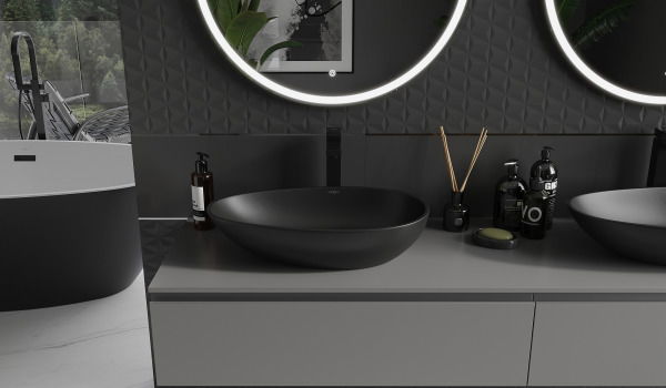 Vanities made of conglomerate in a gray-black bathroom