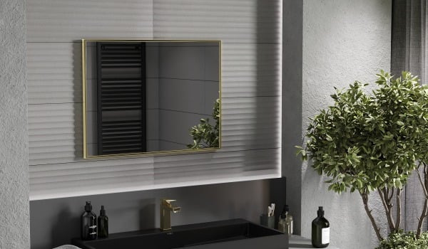 Gold details in a dark bathroom